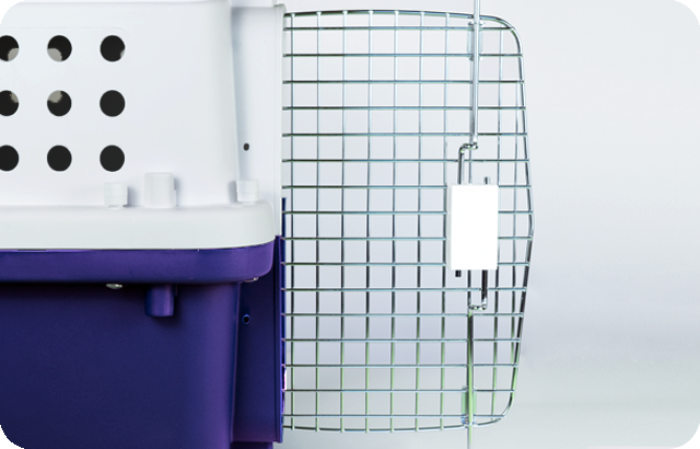 A fully open metal wire door attached to a pet carrier, showing the locking mechanism.